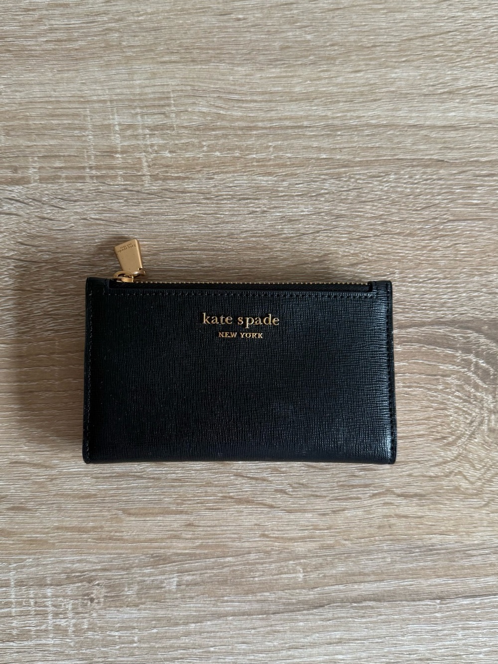 Kate Spade Morgan Small Slim Bifold Wallet
Black leather gold zipper